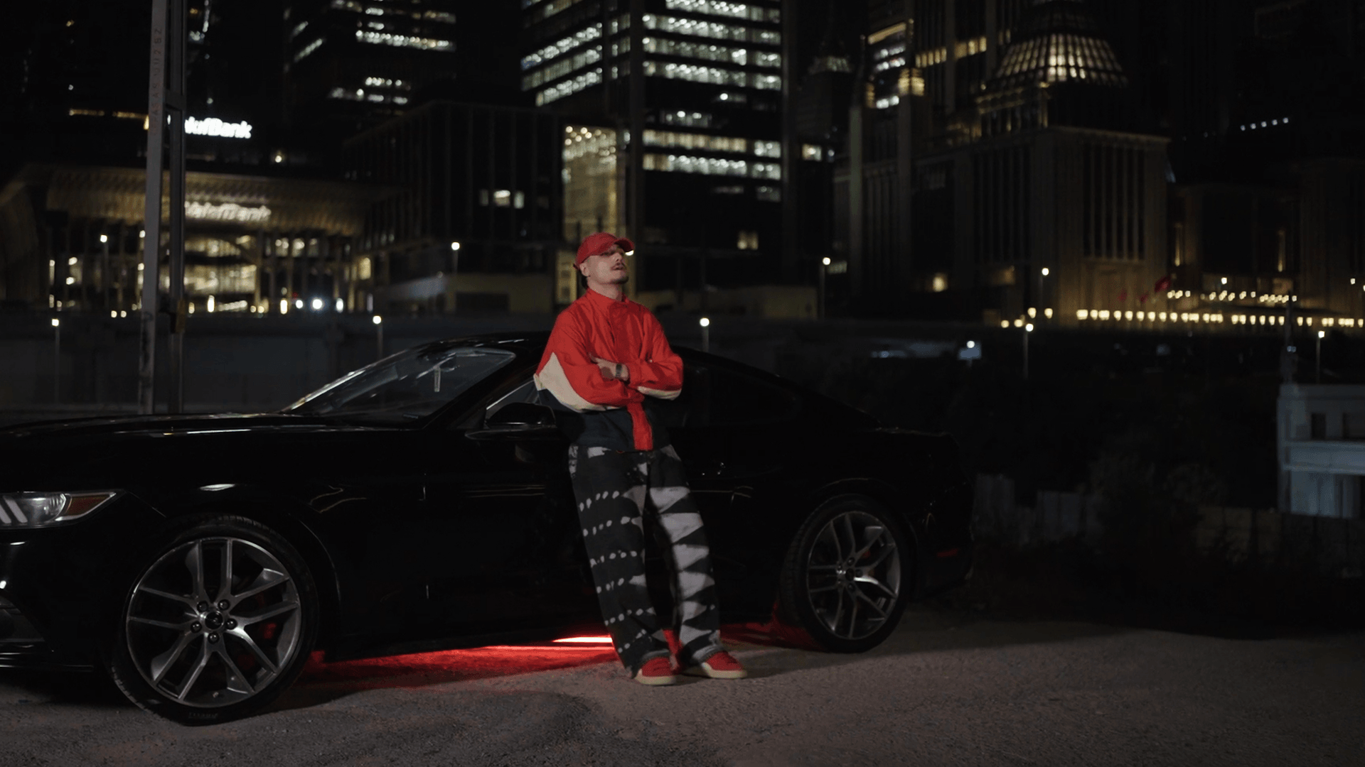 WAYB355 standing beside a car at night